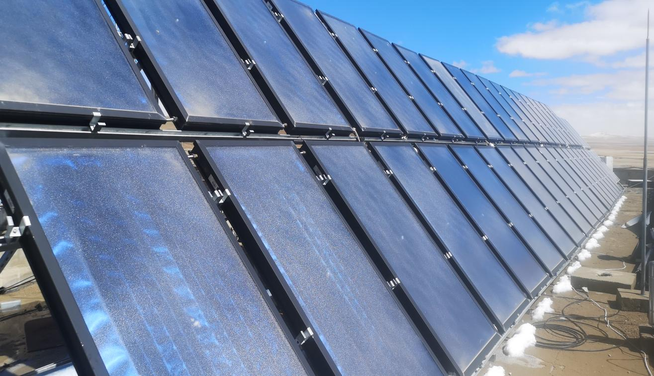 Modern multi-story villa with clean roofline — the type of building where split pressurized solar water heating is the default architecture